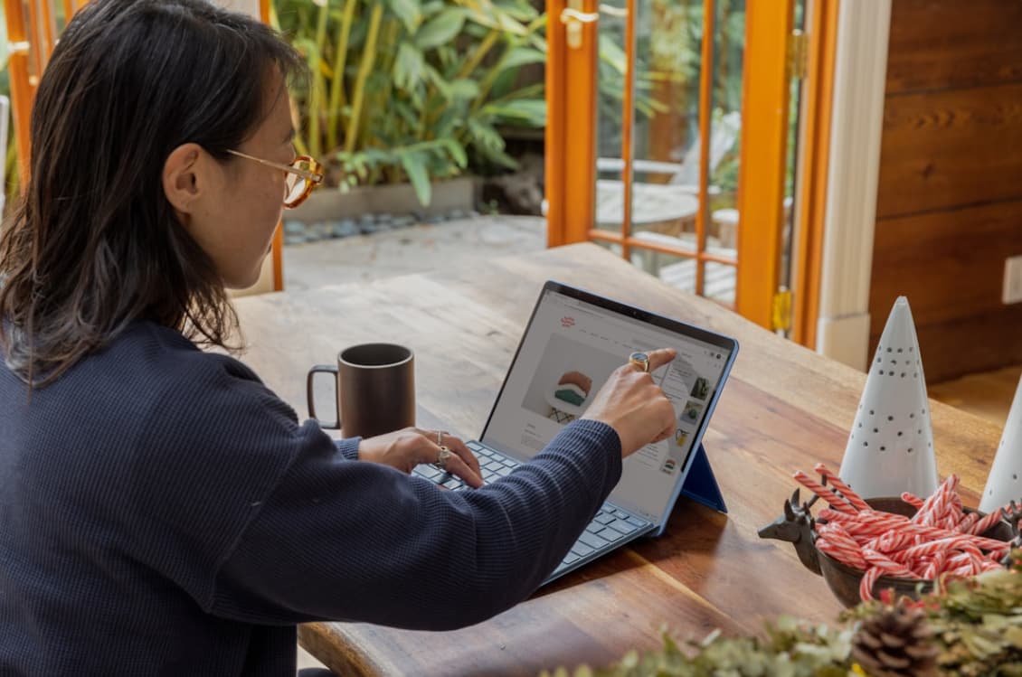 A woman working on business in an office on her laptop